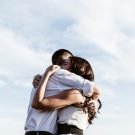 man and woman hugging each other photography